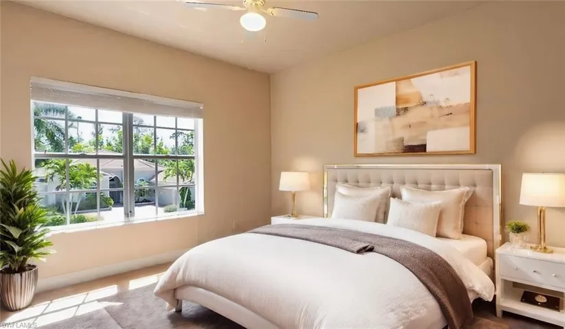 Bedroom featuring ceiling fan and carpet floors