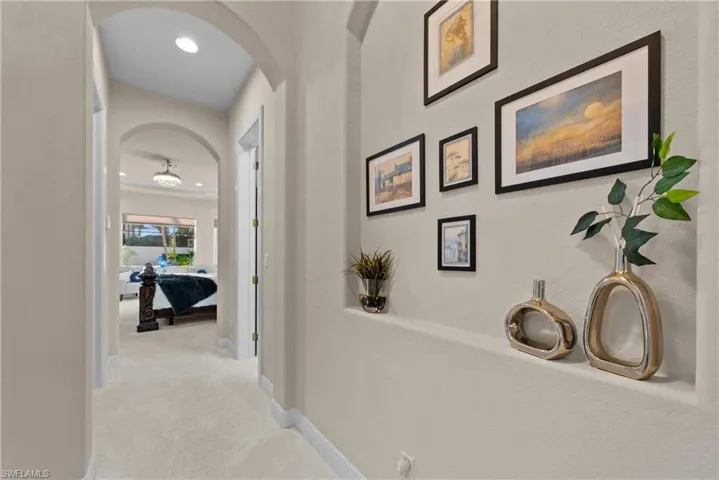 Corridor with light colored carpet