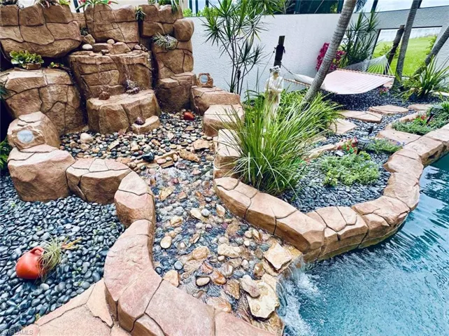 View of yard with a small pond