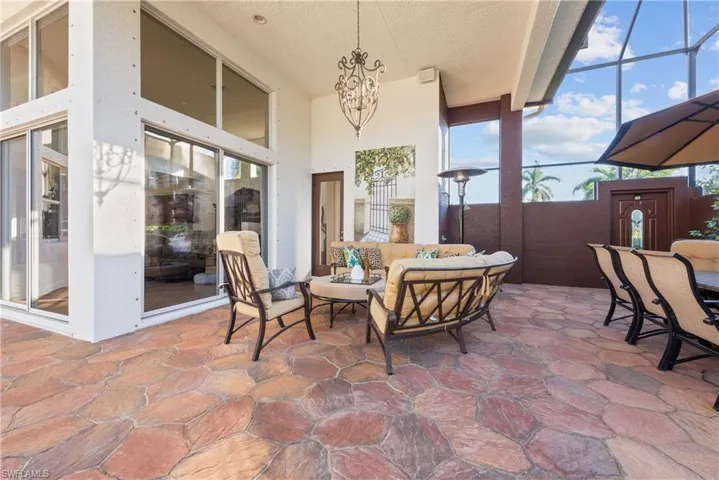 View of patio / terrace featuring outdoor lounge area and glass enclosure