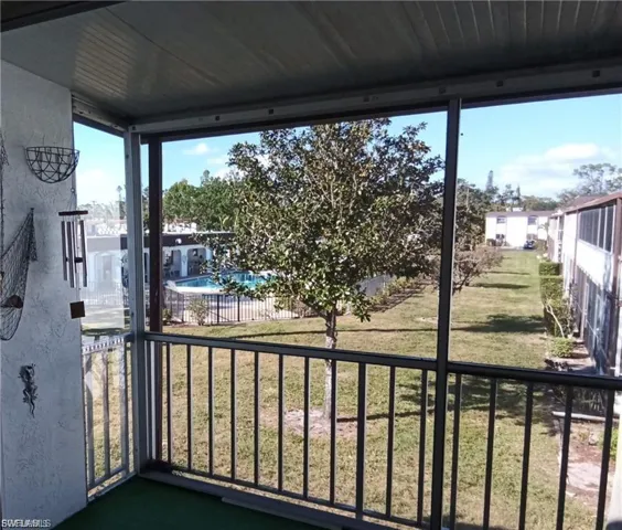 Balcony with view of pool