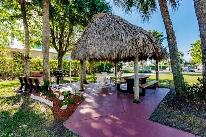 Surrounding community with a lawn, a patio area, and a gazebo