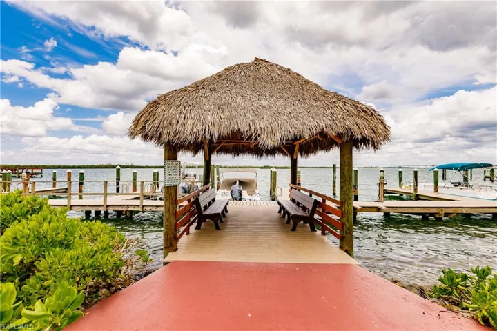 Dock area with a gazebo and a water view