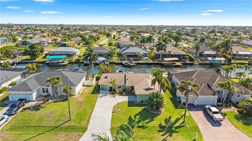 Aerial view of residential area with a nearby body of water