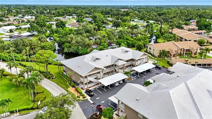 Aerial perspective of suburban area with a large body of water