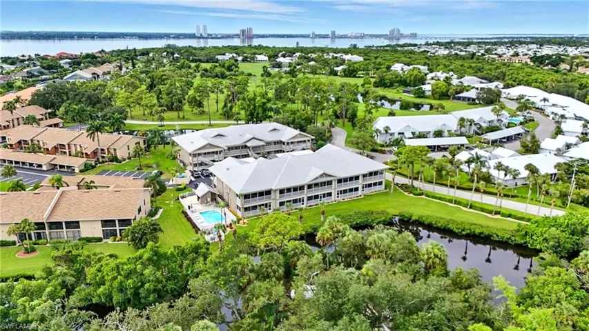 Aerial perspective of suburban area featuring a large body of water
