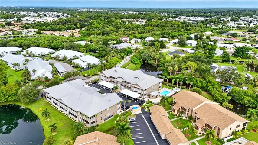 Aerial perspective of suburban area with a large body of water