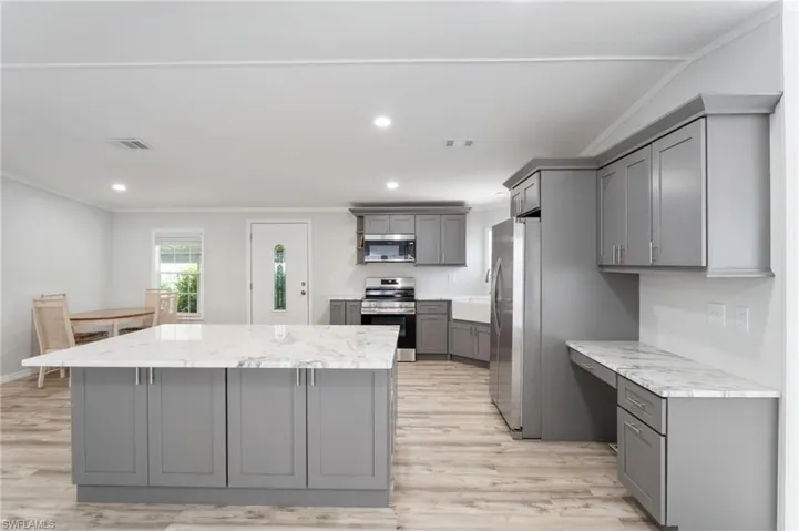 Kitchen even includes a desk area with even more storage.