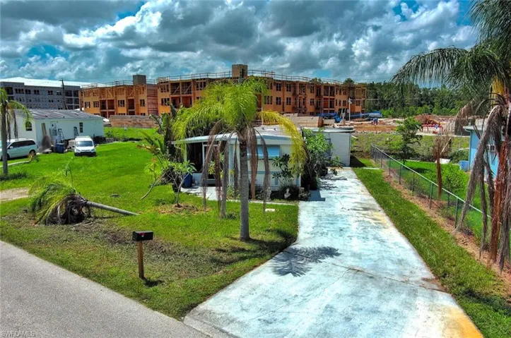 View of community featuring a lawn