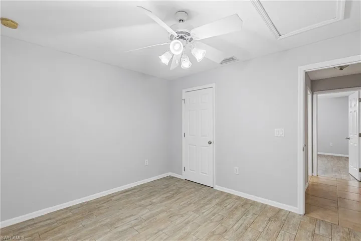 Empty room featuring light hardwood / wood-style floors and ceiling fan