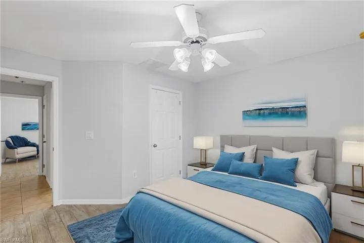 Bedroom featuring light hardwood / wood-style floors and ceiling fan