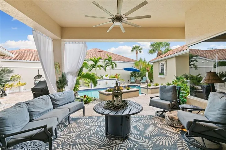 View of patio / terrace featuring outdoor lounge area, ceiling fan, and an outdoor pool