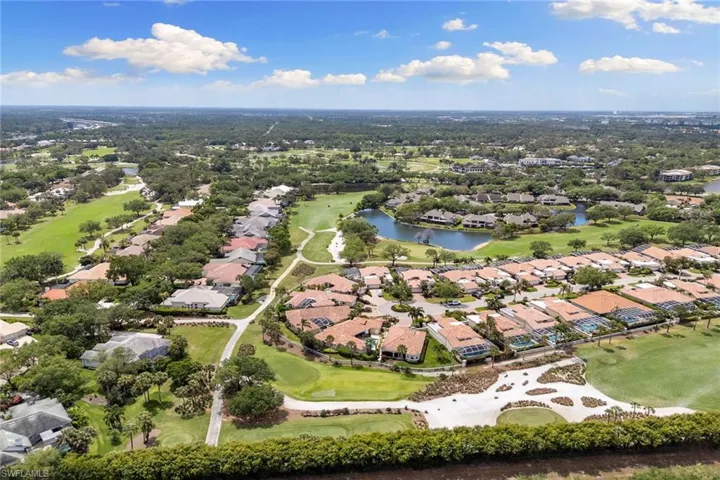 Aerial view of property's location featuring nearby suburban area and a local golf course