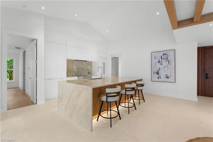 Open and airy kitchen with island.