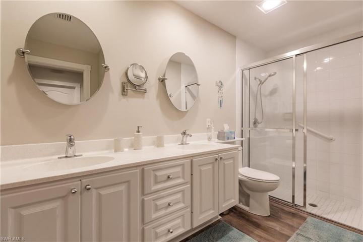 Master bathroom with dual sinks and large shower.  It also has linen closet.