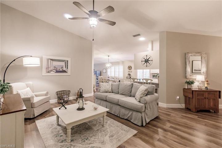 Great room opens to kitchen and dining areas.
