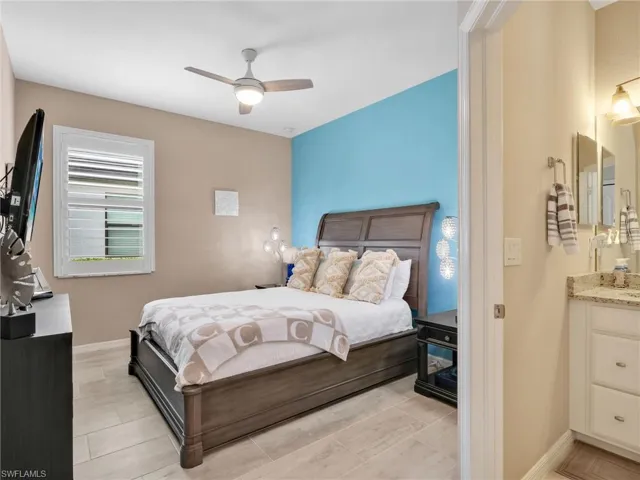 Bedroom featuring baseboards and ceiling fan
