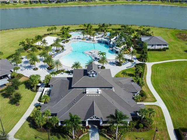 Drone / aerial view of a pool and a large body of water
