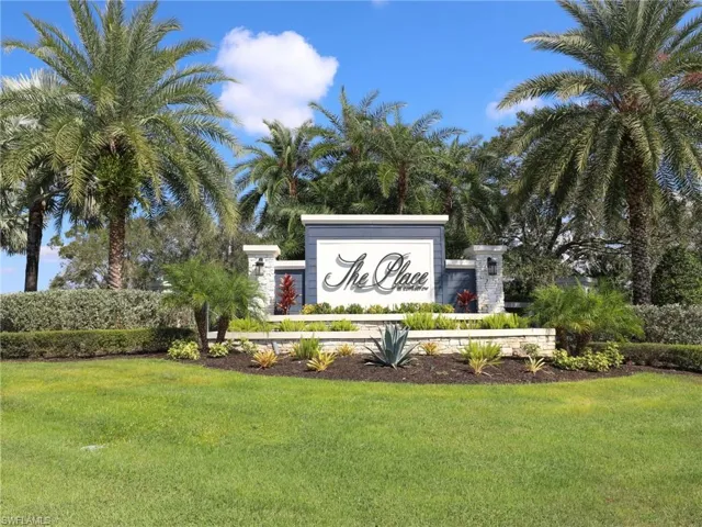 Community / neighborhood sign with a lawn