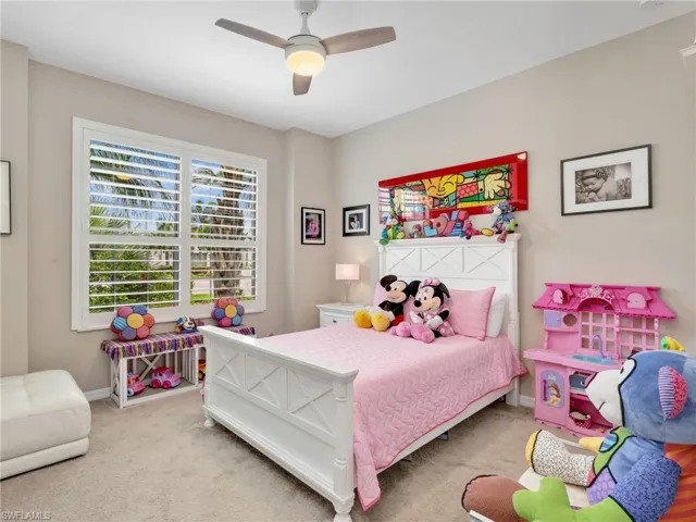 Bedroom featuring carpet and a ceiling fan