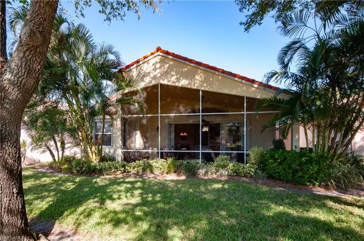 Rear View of Home featuring Yard and Lake