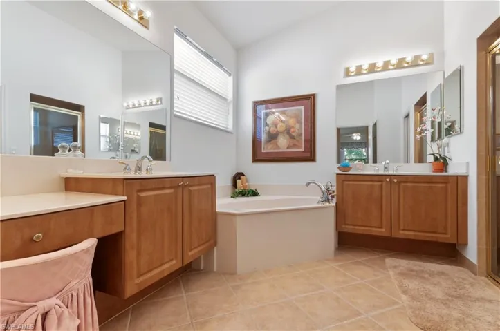 Master Bathroom with Soaking Tub and Tiled Glass Shower, Dual Sinks and Vanity.
