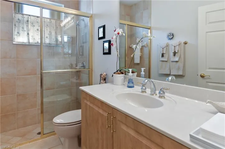 Guest Bathroom featuring Tiled Glass Shower