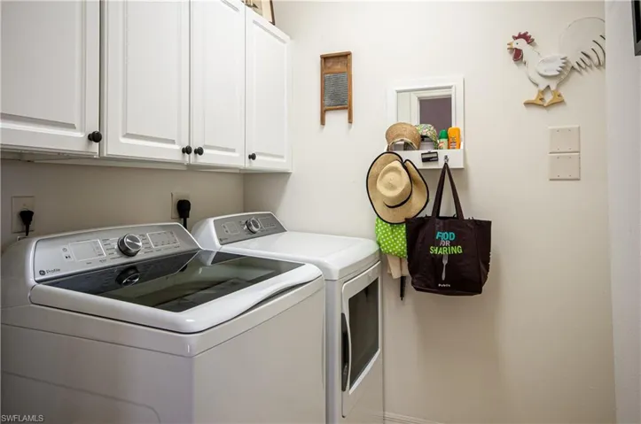Washroom with Cabinets and Washer and Dryer