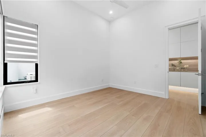 Built-in cabinets in guest foyer with ambient lighting