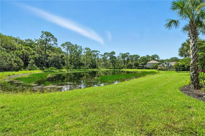 View of grassy yard featuring a water view