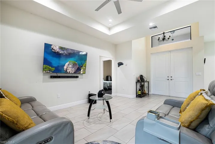 Living room featuring ceiling fan