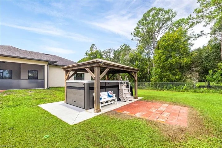 View of yard with a gazebo and a patio