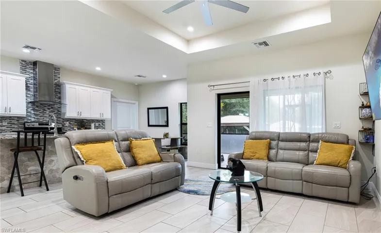Living room featuring ceiling fan