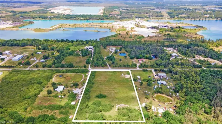 Aerial view with a forest view and a water view