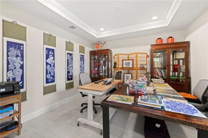 Crown molding and recessed lighting in tray ceiling