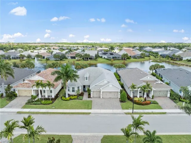 Aerial view of property w/lake behind