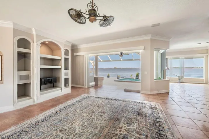 Virtually modified photo-GREAT ROOM FACING LANAI & RIVER