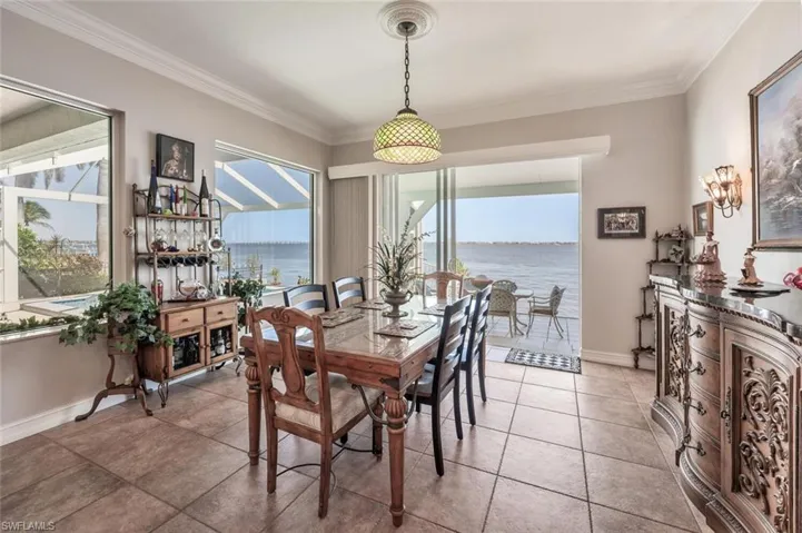 DINING ROOM W/SLIDERS TO LANAI & RIVER VIEW