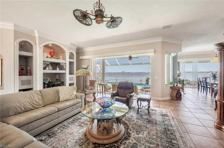 GREAT ROOM FACING SLIDERS TO LANAI W/RIVER IN DISTANCE - VIEW 2