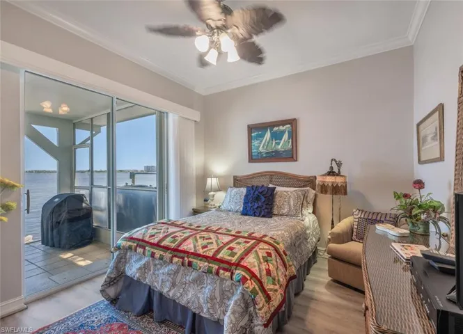 GUEST BEDROOM 1 W/SLIDERS TO LANAI & LUXURY VINYL FLOORING