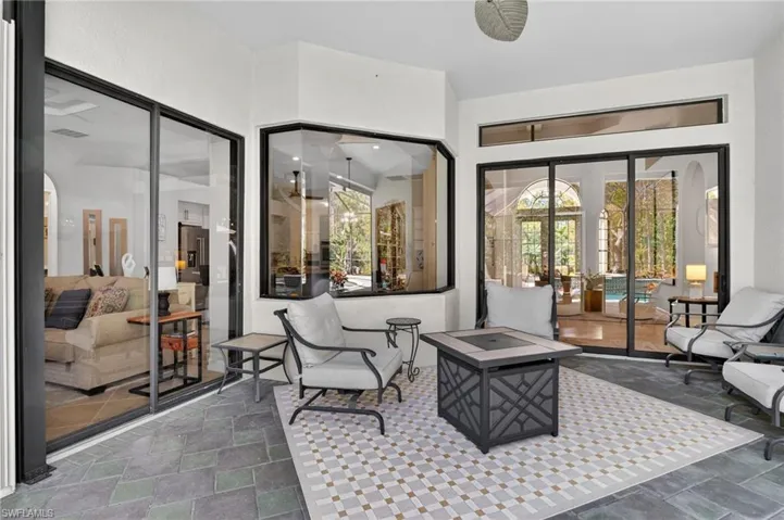 View of patio / terrace featuring a fire pit and french doors