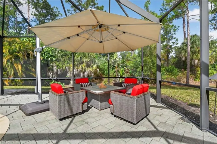 View of patio / terrace featuring an outdoor living space, a sunroom, and a lanai