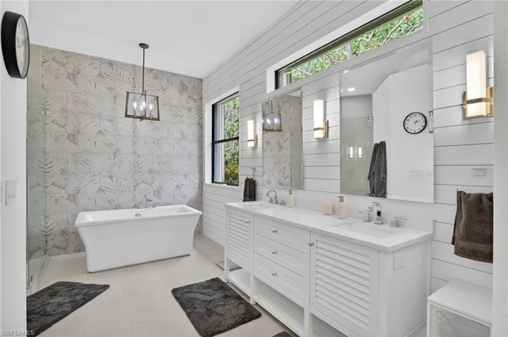 Bathroom with double vanity and a soaking tub