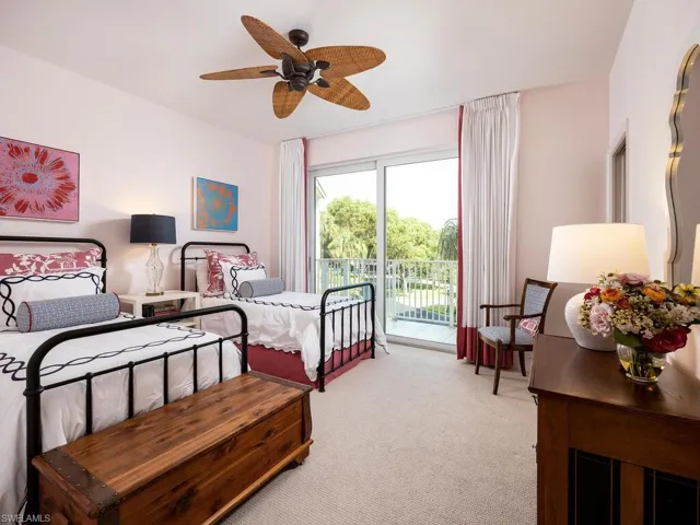 Bedroom featuring access to exterior, light carpet, and ceiling fan