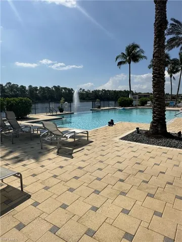 View of swimming pool featuring pool water feature