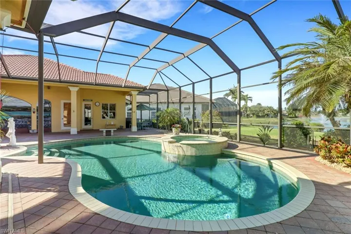 View of swimming pool with a sunroom, a patio, a lanai, and a pool with connected hot tub