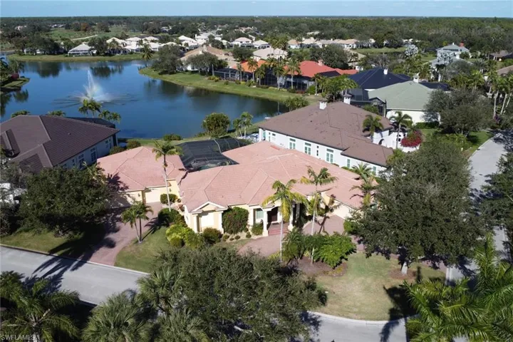 Aerial view of residential area featuring a large body of water