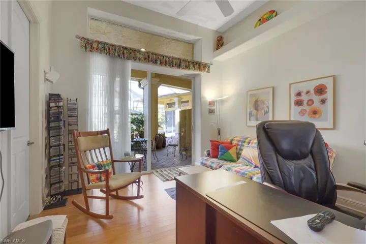 Office area featuring light wood finished floors and a ceiling fan