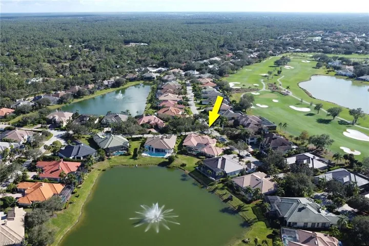 Aerial overview of property's location featuring a nearby body of water and nearby suburban area