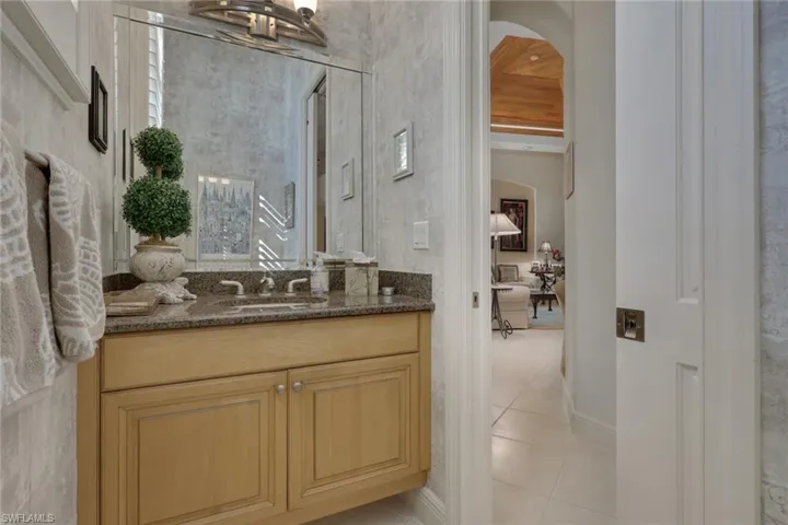 Bathroom featuring vanity and light tile patterned floors